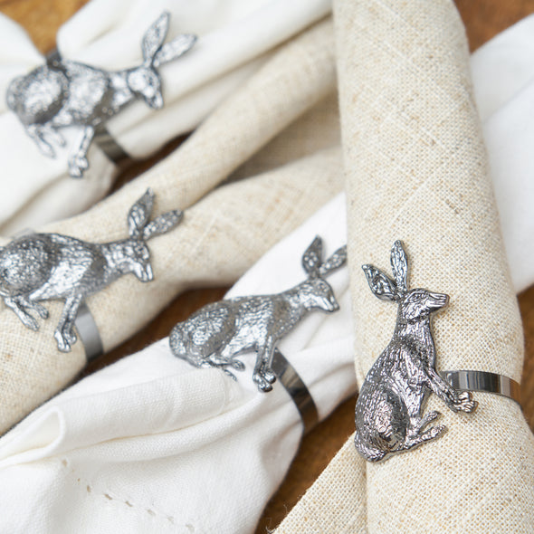 charcoal rabbit napkin ring set in use on napkins