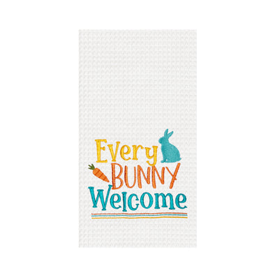 every bunny welcome embroidered on to a white waffle weave kitchen towel