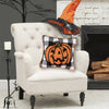 jack-o-lantern halloween throw pillow styled on a chair